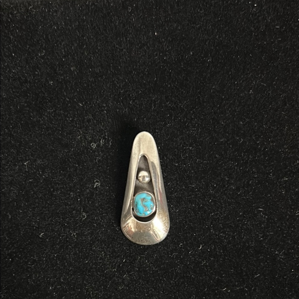 Native American sterling silver/turquoise pendant.